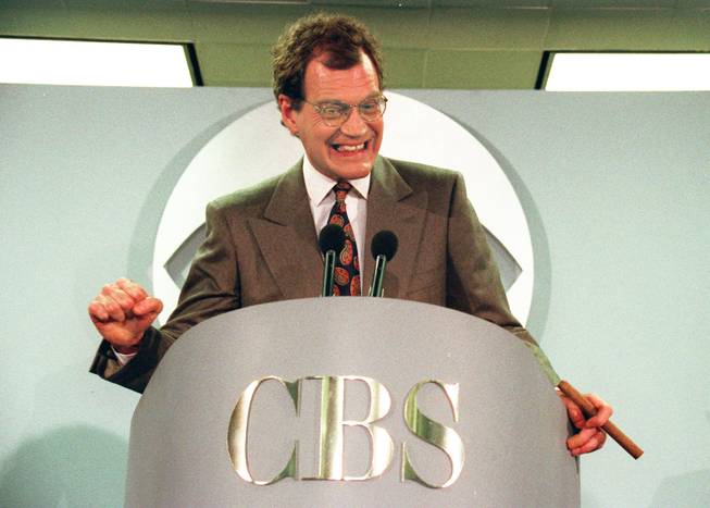 This Jan. 15, 1993 file photo shows talk-show host David Letterman announces his new contract with CBS television for his new show "The Late Show with David Letterman," in New York.  Letterman announced his retirement during a taping on Thursday, April 3, 2014. Although no specific date was announced he told the audience that he will leave his desk sometime in 2015. 