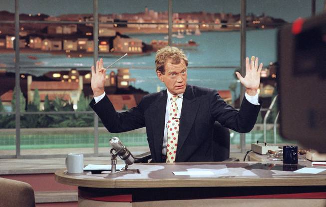  This May 9, 1994 file photo released by CBS shows David Letterman gesturing during a week-long taping of the "Late Show with David Letterman," in Los Angeles.  Letterman announced his retirement during a taping on Thursday, April 3, 2014. Although no specific date was announced he told the audience that he will leave his desk sometime in 2015.