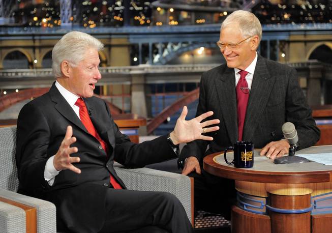 In this photo provided by the Late Show with David Letterman, former U.S. President Bill Clinton, left, chats with host David Letterman during an appearance on Letterman's late night talk show on the CBS television network Monday, Sept. 23, 2013. 