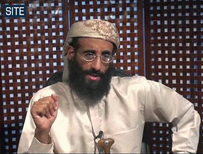 In this image taken from video and released on Monday, Nov. 8, 2010, Anwar al-Awlaki speaks in a video message posted on radical websites. 