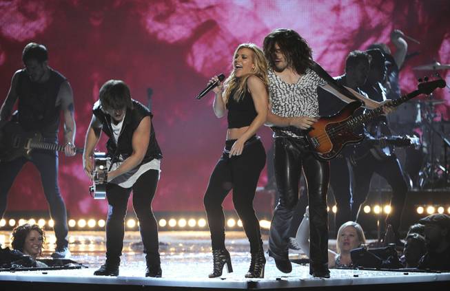 Neil Perry, Kimberly Perry and Reid Perry of The Band Perry open the 49th Annual Academy of Country Music Awards at MGM Grand Garden Arena on Sunday, April 6, 2014, in Las Vegas.
