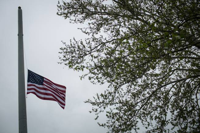 An American flag flies at half-staff on Sunday, April 6, 2014, in Killeen, Texas, to honor those killed and wounded in the Fort Hood shooting on April 2. Three people were killed and 16 were wounded when a gunman opened fire before taking his own life at the Fort Hood military base.