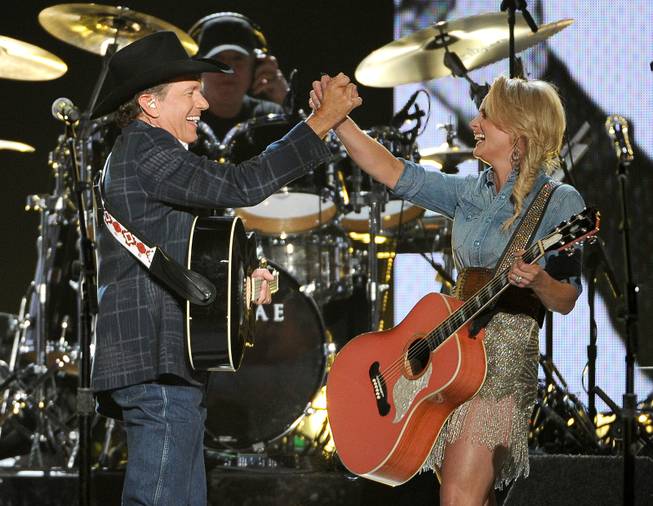 George Strait and Miranda Lambert perform during the 49th Annual Academy of Country Music Awards at MGM Grand Garden Arena on Sunday, April 6, 2014, in Las Vegas. 