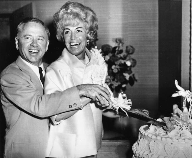 Actor Mickey Rooney and his new wife Margie Lane cut the cake at their wedding reception at the Desert Inn Hotel Casino in Las Vegas, Nev., on September 10, 1966. 