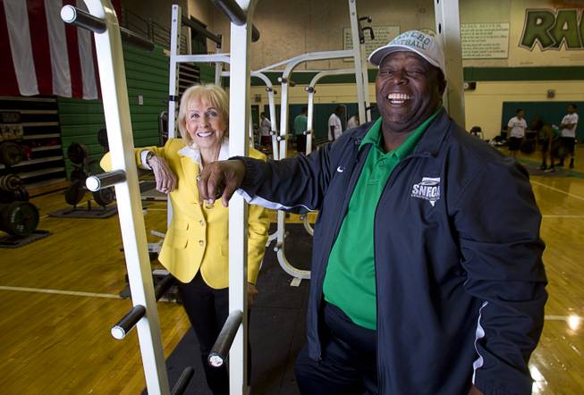 Susan Spencer, former general manager of the Philadelphia Eagles, poses with football coach Tyrone Armstrong at Rancho High School Monday, April 7, 2014. Spencer's nonprofit A Level Playing Field has given more than $30,000 of equipment and funds to the Rancho HS football team.