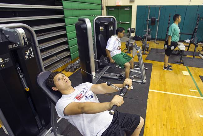 Jose Cortes works out on a Bilt seated triceps machine at Rancho High School on Monday, April 7, 2014. Susan Spencer's nonprofit A Level Playing Field has given more than $30,000 of equipment and funds to the Rancho football team.