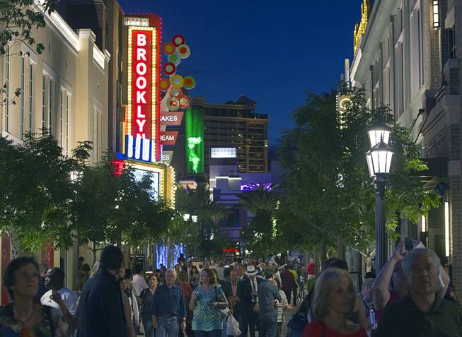 People stroll through the Linq Wednesday, April 9, 2014. The $550 million Linq project is a retail, dining and entertainment district developed by Caesars Entertainment Corp.