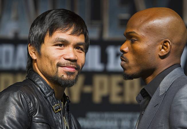 Boxer Manny Pacquiao, left, of the Philippines and undefeated WBO welterweight champion Timothy Bradley pose during a news conference at the MGM Grand Wednesday, April 9, 2014. Pacquiao will challenge Bradley at the MGM Grand Garden Arena on Saturday. The fight is a rematch to a June 9, 2012 fight that Bradley won.