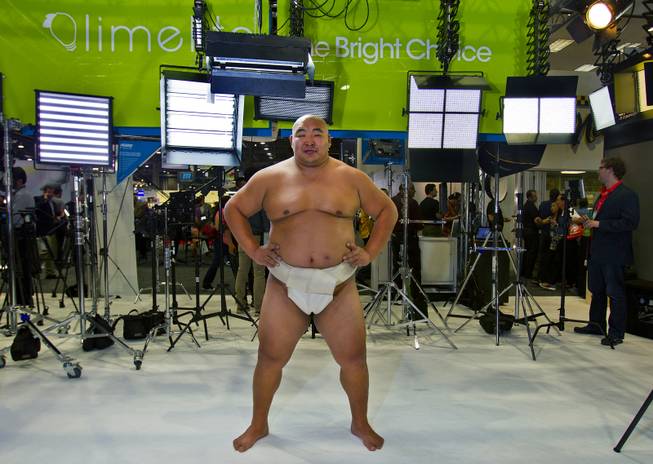 World Champion Sumo Wrestler Byamba is on hand to promote Tenba Camera Bags in the MAC Group display during the National Association of Broadcasters show on Tuesday, April 8, 2014.