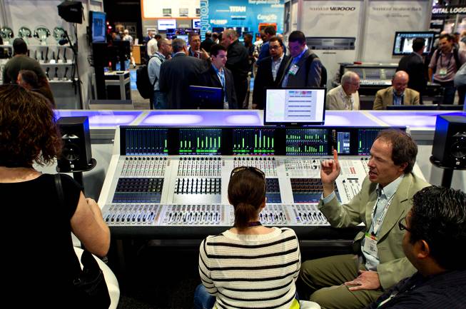 Rob Lewis introduces attendees to the Studer Infinity Series mixing board during the National Association of Broadcasters show at the Las Vegas Convention Center on Tuesday, April 8, 2014.
