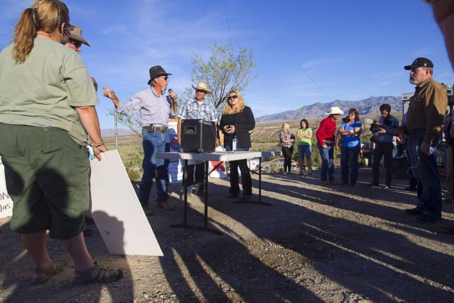 Charlie Childers of Logandale speaks during a protest in support of the Bundy family near Bunkerville Thursday, April 10, 2014. With Childers are Ammon Bundy, center, and state Assemblywoman Michele Fiore.