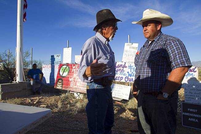Charlie Childers, left, of Logandale speaks with Dave Bundy during a protest in support of the Bundy family near Bunkerville Thursday, April 10, 2014.