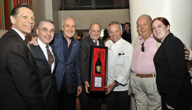 Wolfgang Puck, third from right, receives the UNLVino Dom Perignon Award of Excellence during Sip & Savor at his restaurant Spago on Wednesday, April 9, 2014, in the Forum Shops at Caesars Palace.