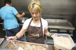 Suni Chadbrow, founder of WHOA! Toffee, makes up a batch of fresh english toffee, Monday April 7, 2014.