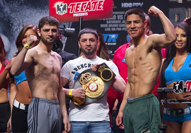Super lightweight boxers Khabib Allakhverdiev, left, of Russia and Jessie Vargas of Las Vegas pose during an official weigh-in at the MGM Grand Garden Arena Friday, April 11, 2014. The boxers will fight for an WBA interim lightweight title.