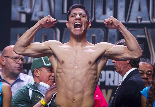 Super lightweight boxer Jessie Vargas of Las Vegas yells during an official weigh-in at the MGM Grand Garden Arena Friday, April 11, 2014. Vargas will fight Khabib Allakhverdiev of Russia for an WBA interim lightweight title at the arena on Saturday.