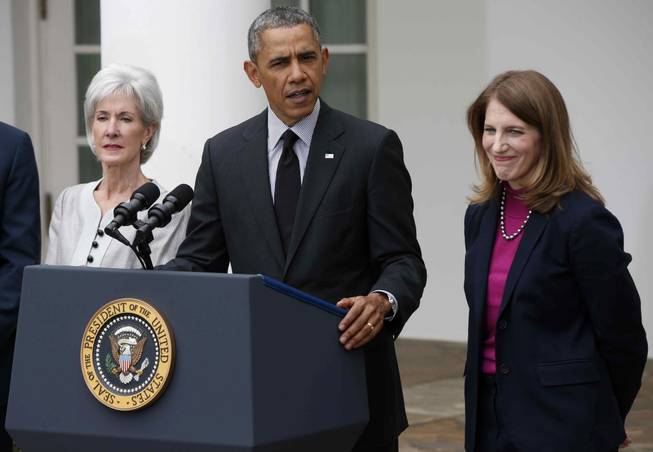 President Barack Obama, flanked by outgoing Health and Human Services Secretary Kathleen Sebelius, left, and his nominee to be her replacement, Budget Director Sylvia Mathews Burwell, speaks in the Rose Garden of the White House in Washington, Friday, April 11, 2014.