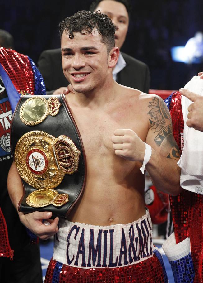 Bryan Vasquez of Costa Rica celebrates his unanimous decision over Jose Felix of Mexico in their WBA interim super featherweight fight at the MGM Grand Garden Arena on Saturday, April 12, 2014.