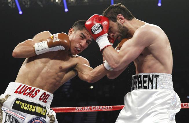 Jessie Vargas of Las Vegas hits Khabib Allakhverdiev of Russia with a left during their WBA interim super lightweight fight at the MGM Grand Garden Arena on Saturday, April 12, 2014.