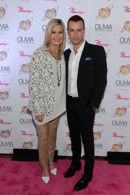 Olivia Newton-John and Joey Lawrence walk the pink carpet on ...
