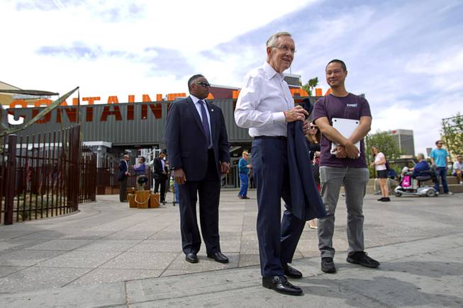 Senate Majority Leader Harry Reid (D-NV) finishes a tour of downtown Las Vegas with Zappos CEO Tony Hsieh, right, in front of the Las Vegas Container Park Tuesday, April 15, 2014.