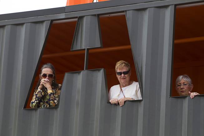 Henderson residents, from left, Vernette Langley, Gay Fleming, and Billie Means, watch as Senate Majority Leader Harry Reid (D-NV) talks with reporters at Las Vegas Container Park Tuesday, April 15, 2014.