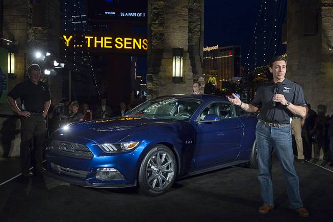 Mark Fields (R), chief operating officer for Ford Motor Company, speaks in front of a 2015 50 Year Limited Edition Mustang outside the New York-New York Thursday April 17, 2014. The unveiling was part of the Mustang 50th Birthday Celebration taking place at the Las Vegas Motor Speedway. Ford announced that they will build 1,964 of the 50-Year Limited Edition model.