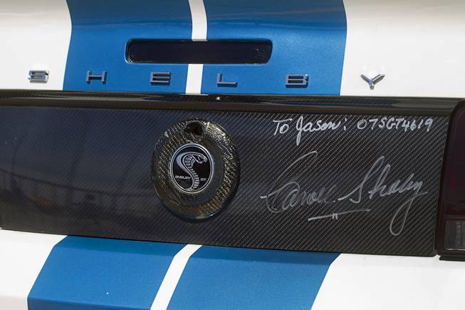 A late-model Mustang Shelby, sporting an autograph by automotive designer Carroll Shelby, is displayed during the Mustang 50th Birthday Celebration at the Las Vegas Motor Speedway Thursday, April 17, 2014.