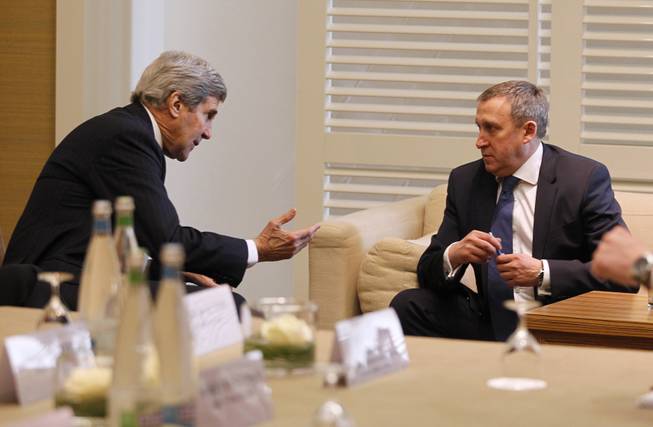 U.S. Secretary of State John Kerry, left, meets with Ukrainian Foreign Minister Andrii Deshchytsia for a bilateral meeting to discuss the ongoing situation in Ukraine as diplomats from the United States, Ukraine, Russia and the European Union gather for discussions in Geneva, Switzerland, Thursday, April 17, 2014.