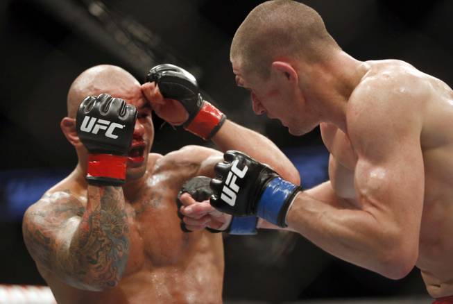 Thiago Alves, left, and Seth Baczynski fight in a mixed martial arts event on Saturday, April 19, 2014, at UFC Fight Night in Orlando, Fla. Alves won.