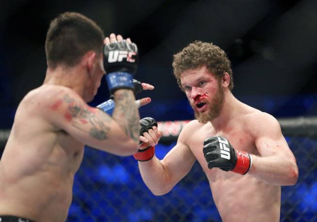 Dustin Ortiz, right, and Ray Borg fight in a mixed martial arts event on Saturday, April 19, 2014, at UFC Fight Night in Orlando, Fla. Ortiz won.