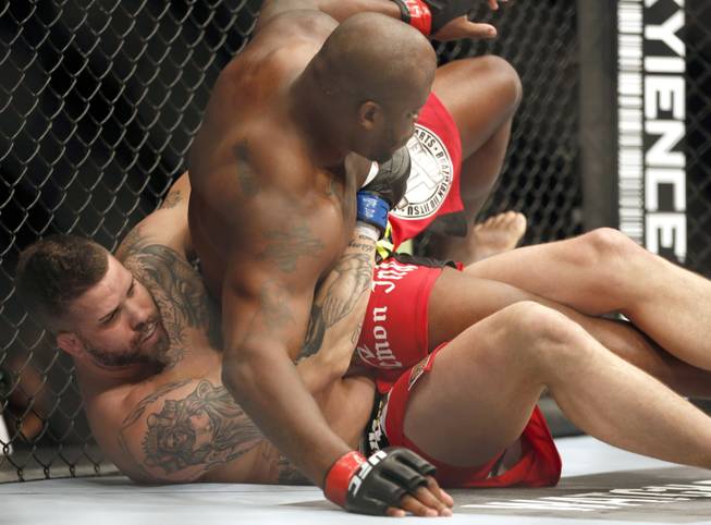 Derrick Lewis, top, and Jack May fight in a mixed martial arts event on Saturday, April 19, 2014, at UFC Fight Night in Orlando, Fla. Lewis won.