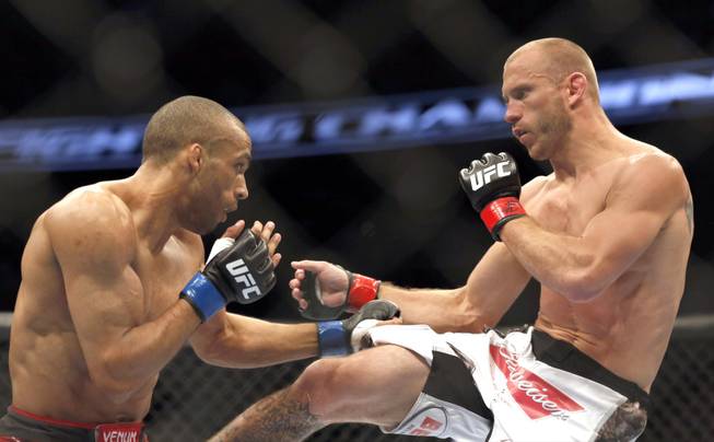 Donald Cerrone, right, and Edson Barboza, of Brazil, fight in a mixed martial arts event on Saturday, April 19, 2014, at UFC Fight Night in Orlando, Fla. Cerrone won by tap out.