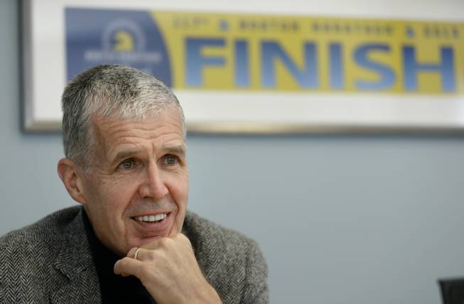 In this photo taken April 10, 2014, photo Boston Athletic Association Executive Director Tom Grilk speaks with an Associated Press reporter in his office in Boston. More than 5,000 runners were still on the Boston Marathon course when the bombs went off near the finish line in 2013, so the field was expanded for the 2014 marathon to accommodate them. "The thought was: If those people, like so many others, wanted to have some physical expression of resilience and determination, it would probably be that many of them at least would want to run the whole race," Grilk said.