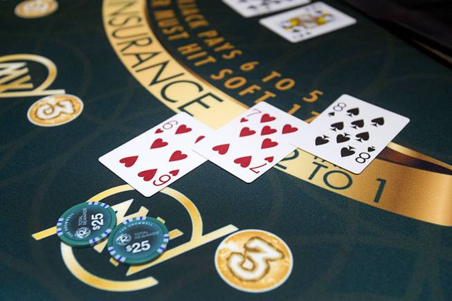 A gambler's blackjack hand is shown during the opening of the casino floor at the Cromwell, formerly Bill's Gamblin' Hall & Saloon, on the Las Vegas Strip and Flamingo Avenue, Monday, April 21, 2014.