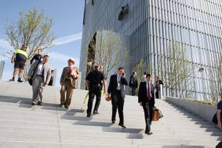 Federal Courthouse employees evacuate as police investigate a shooting inside the Federal Courthouse, Monday, April 21, 2014, in Salt Lake City. The shooting has left at least one person injured, a spokeswoman for the U.S. attorney said.