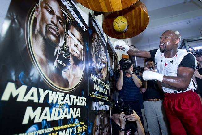 WBC welterweight champion Floyd Mayweather Jr. hits a speed bag during a media workout at the Mayweather Boxing Club Tuesday, April 22, 2014. Mayweather is preparing for his fight against WBA champion Marcos Maidana of Argentina at the MGM Grand Garden Arena on May 3.