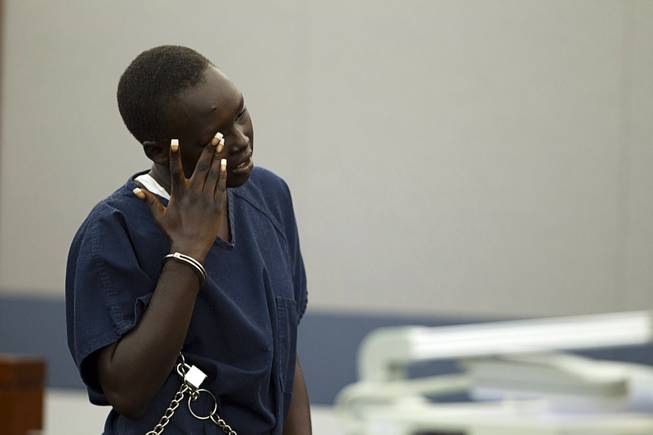 Nyakueth Tear of Salt Lake City, Utah wipes away tears during her sentencing at the Regional Justice Center Tuesday, April 22, 2014. Tear struck eight pedestrians with her car in the street outside of a North Las Vegas church in August 2013 and fled the scene.