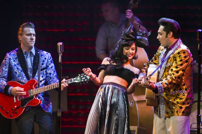 Melody Sweets dances between Robert Britton Lyons as Carl Perkins and  Justin Shandor as Elvis during her guest appearance in “Million Dollar Quartet” on Tuesday, April 22, 2014, at Harrah’s.

