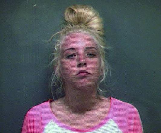 This booking photo released by Kingsport Police Department, shows Dallas Archer, 19, accused of smuggling a loaded mini revolver inside herself and bringing it into the Kingsport, Tenn. Jail, on Monday, April 21, 2014.