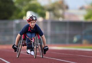 Blake Dickinson, 11, a sixth grader at Cadwallader Middle School student, practices with his trike on the track during a Paralympic Sports Night at Rancho High School Wednesday, April 23, 2014.
