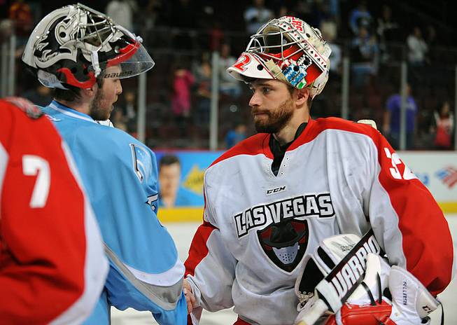 Las Vegas Wranglers goaltender Travis Fullerton shakes hands with Alaska Aces goaltender Olivier Roy after the Aces defeated the Wranglers 4-3 on Friday night at the Orleans Arena. The Aces eliminated the Wranglers in four straight games to end their season.