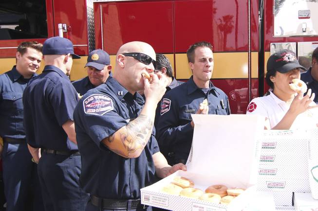 Firefighters from the Las Vegas Fire Department Headquarters in Downtown Las Vegas enjoy a gift from Krisypy Kreme on Friday, April 25, 2014 for National Hero Appreciation Day, which is actually on Monday.