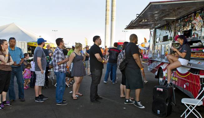 Customers stand in line to place orders at Fukuburger during the Third Annual Las Vegas Foodie Fest across from the Luxor Hotel on Thursday, April 24, 2014.