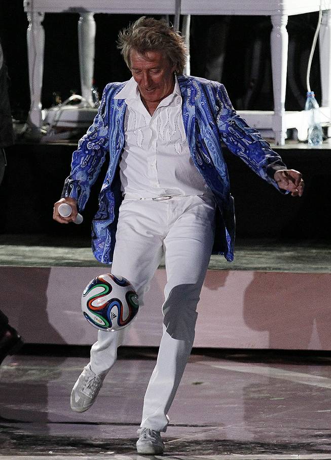 Rod Stewart kicks a soccer ball to the crowd as he performs at the Vina del Mar International Song Festival in Vina del Mar, Chile, Thursday, Feb. 27, 2014. 