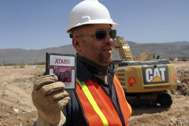 Film Director Zak Penn shows a box of a decades-old Atari 'E.T. the Extra-Terrestrial' game found in a dumpsite in Alamogordo, N.M., Saturday, April 26, 2014. Producers of a documentary dug in a southeastern New Mexico landfill in search of millions of cartridges of the game that has been called the worst game in the history of video gaming and were buried there in 1983.