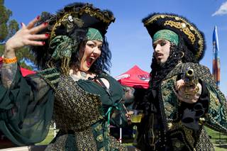 Renee LeRoux, left, and Mannifred Yates pose during the second annual Pirate Festival Las Vegas in Lorenzi Park Sunday, April 27, 2014.