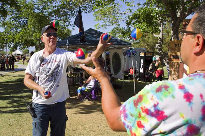 Rich Strelak, left, owner of Pirate Fest, and Paul Dicianno juggle during the second annual Pirate Festival Las Vegas in Lorenzi Park Sunday, April 27, 2014.