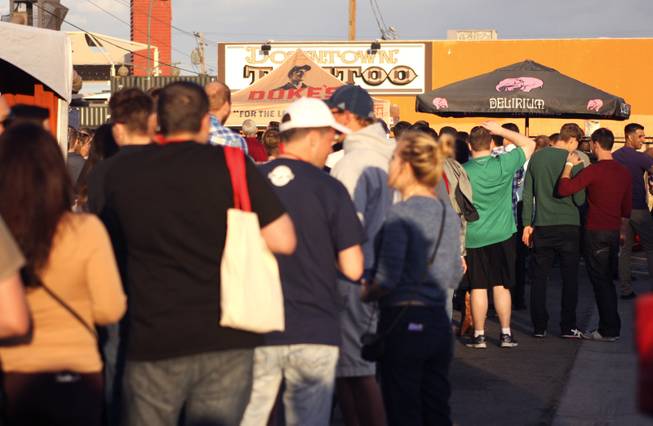 Festival goers wait in line to get a taste of Delirium beer during the "Great Vegas Festival of Beer" gathering on Fremont East Entertainment District Saturday, April 26, 2014.