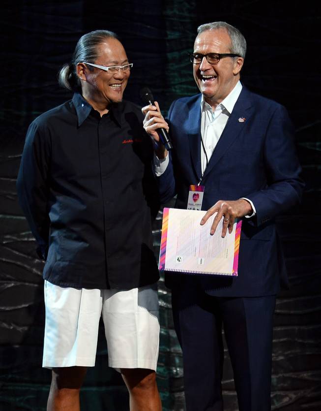 Chef Masaharu Morimoto and Keep Memory Alive founder Larry Ruvo speak onstage during a live auction at the 18th annual Keep Memory Alive “Power of Love Gala” benefit for the Cleveland Clinic Lou Ruvo Center for Brain Health honoring Gloria Estefan and Emilio Estefan Jr. on Saturday, April 26, 2014, at MGM Grand Garden Arena.

